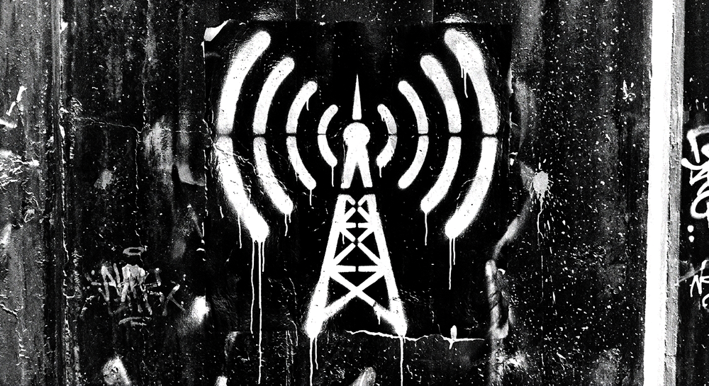 Stencil art of a radio tower broadcasting signal