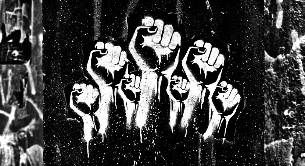 Stencil art of several raised fists